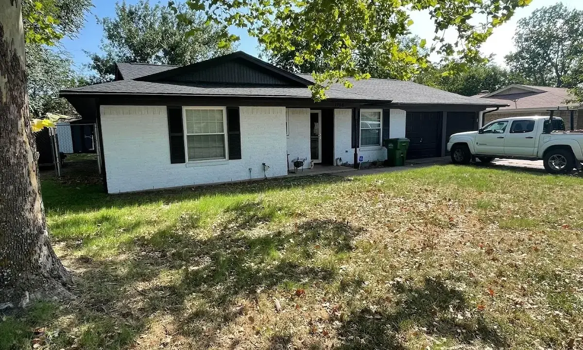 Professional roofing crew working on a residential roof in King City